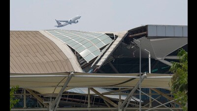New Delhi: A plane takes off from the Indira Gandhi International Airport where a canopy collapsed on vehicles parked at Terminal- 1 amid heavy rain, in New Delhi, Friday, June 28, 2024. One person died and five were injured in the collapse. (PTI Photo/Kamal Singh) (PTI06_28_2024_000297A) (PTI) New Delhi: A plane takes off from the Indira Gandhi International Airport where a canopy collapsed on vehicles parked at Terminal- 1 amid heavy rain, in New Delhi, Friday, June 28, 2024. One person died and five were injured in the collapse. (PTI Photo/Kamal Singh) (PTI06_28_2024_000297A) (PTI)