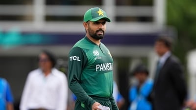 Pakistan's captain Babar Azam waits for the coin toss before the beginning of the ICC Men's T20 World Cup cricket match between Ireland and Pakistan (AP) Pakistan's captain Babar Azam waits for the coin toss before the beginning of the ICC Men's T20 World Cup cricket match between Ireland and Pakistan (AP)
