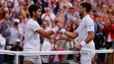 Spain's Carlos Alcaraz (Left) with Serbia's Novak Djokovic after winning the Wimbledon final. (REUTERS)