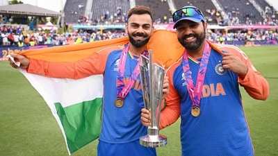 India's captain Rohit Sharma and Virat Kohli pose for a picture with the trophy after Team India wins the ICC Mens T20 World Cup 2024. (ICC - X ) India's captain Rohit Sharma and Virat Kohli pose for a picture with the trophy after Team India wins the ICC Mens T20 World Cup 2024. (ICC - X )