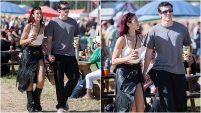 After giving a thrilling performance at this year's Glastonbury Music Festival, Dua Lipa embraced a casual aesthetic as she attended the festival with her boyfriend, Callum Turner.&nbsp;She wore a classic white tank crop top with a draped leather skirt marked by oversized cargo pockets. She styled the ensemble with an over-the-body bag, sunglasses, slouchy black boots, and striking red hair left loose.&nbsp; (Instagram)
