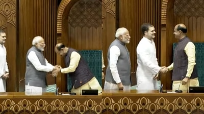 Prime Minister Narendra Modi and Congress leader Rahul Gandhi shaking hands with Speaker Om Birla. Prime Minister Narendra Modi and Congress leader Rahul Gandhi shaking hands with Speaker Om Birla.