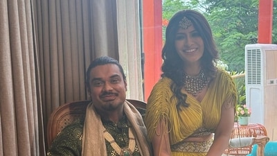 Varalaxmi Sarathkumar and Nicholai Sachdev pose together at their mehendi. Varalaxmi Sarathkumar and Nicholai Sachdev pose together at their mehendi.