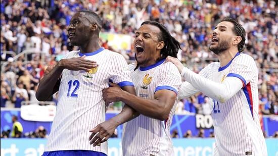 France players celebrate their goal against Belgium in the Round of 16 game in Dusseldorf. (AP)