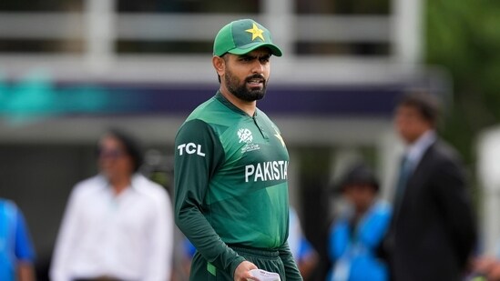 Pakistan's captain Babar Azam waits for the coin toss before the beginning of the ICC Men's T20 World Cup cricket match between Ireland and Pakistan (AP)