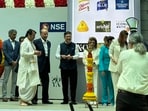 A pandit onstage during the listing ceremony of Allied Blenders.