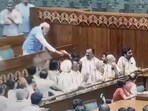 Prime Minister Narendra Modi offers water to opposition MPs who were shouting slogans in the Well of the House.