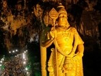 A large statue of Lord Murugan is illuminated as devotees climb the steps to Batu Caves in Kuala Lumpur, Malaysia on February 9, 2017.  (Lai Seng Sin / REUTERS)