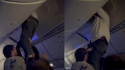 A viral video shows an Air Europa passenger being rescued from the overhead bin. (X/@aviationbrk) A viral video shows an Air Europa passenger being rescued from the overhead bin. (X/@aviationbrk)