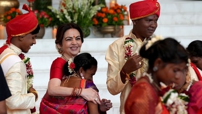 The image shows Nita Ambani hugging a bride at the mass wedding hosted by Ambanis. Mukesh Ambani also attended the celebration. (special arrangement) The image shows Nita Ambani hugging a bride at the mass wedding hosted by Ambanis. Mukesh Ambani also attended the celebration. (special arrangement)