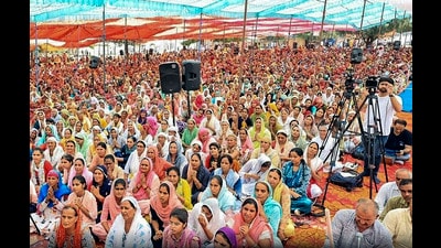 Devotees at the religious gathering where a stampede broke out, in Hathras district on Tuesday. (PTI) Devotees at the religious gathering where a stampede broke out, in Hathras district on Tuesday. (PTI)