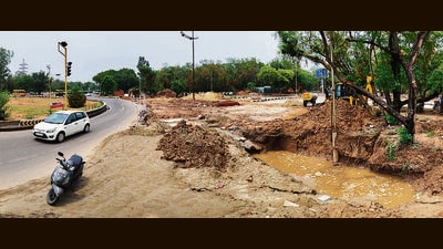 The work, spanning from Sector 40 to Sector 42, has led to road closures and uprooted sidewalks for the past few weeks, already causing inconvenience to commuters and residents alike. (Keshav Singh/HT) The work, spanning from Sector 40 to Sector 42, has led to road closures and uprooted sidewalks for the past few weeks, already causing inconvenience to commuters and residents alike. (Keshav Singh/HT)