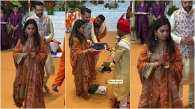 Isha Ambani wore a multi-coloured kurta-palazzo set adorned with heavy embroidery. She draped a dupatta on her shoulders and accessorised the kadhai-work ethnic ensemble with jhumkis, bangles, centre-parted loose tresses, and minimal makeup.&nbsp; (Instagram)