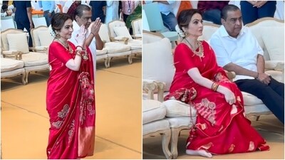 The Ambani family organised a mass wedding for the underprivileged at the Reliance Corporate Park ahead of Anant and Radhika's wedding. Nita Ambani wore a red silk saree for the occasion. The elegant nine yards feature intricate gold brocade embroidery. She wore the drape with a matching silk blouse, an embroidered potli bag, kadhas, gold jhumkis, and a heavy necklace. A centre-parted gajra-adorned bun, kohl-lined eyes, bindi, and striking glam rounded off her look.&nbsp; (Instagram)
