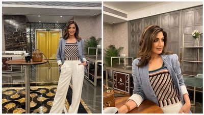 Sonali Bendre embraced the crochet trend in this picture by wearing a multi-coloured cropped blouse, which she styled with a tailored blazer and high-waisted white pants. She styled the chic look with side-parted loose tresses, hoop earrings, a dainty necklace, and minimal glam. (Instagram) Sonali Bendre embraced the crochet trend in this picture by wearing a multi-coloured cropped blouse, which she styled with a tailored blazer and high-waisted white pants. She styled the chic look with side-parted loose tresses, hoop earrings, a dainty necklace, and minimal glam. (Instagram)