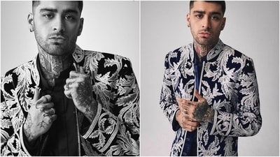 The ensemble that excited Zayn's desi fans the most is a blue and white sherwani designed by Manish Malhotra. He wore a sherwani jacket embroidered in white thread leaf patterns and featured an open Mandarin collar, padded shoulders, full-length sleeves, an open front, and a tailored fitting. (Instagram) The ensemble that excited Zayn's desi fans the most is a blue and white sherwani designed by Manish Malhotra. He wore a sherwani jacket embroidered in white thread leaf patterns and featured an open Mandarin collar, padded shoulders, full-length sleeves, an open front, and a tailored fitting. (Instagram)