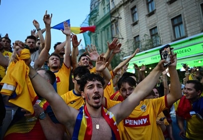 Romanians celebrate the qualification of the Romanian national football team for the next stage of UEFA EURO 2024 (AFP)