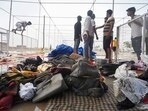 People at the site of the stampede in Hathras on July 03.