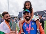 India's Captain Rohit Sharma with his daughter Samaira and Virat Kohli after Team India wins the ICC Mens T20 World Cup 2024 final match against South Africa