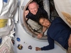 In this photo provided by NASA, Boeing Crew Flight Test astronauts Butch Wilmore, left, and Suni Williams pose for a portrait inside the vestibule between the forward port on the International Space Station's Harmony module and Boeing's Starliner spacecraft on June 13, 2024. (NASA via AP) In this photo provided by NASA, Boeing Crew Flight Test astronauts Butch Wilmore, left, and Suni Williams pose for a portrait inside the vestibule between the forward port on the International Space Station's Harmony module and Boeing's Starliner spacecraft on June 13, 2024. (NASA via AP)