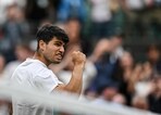 Spain's Carlos Alcaraz celebrates winning against Australia's Aleksander Vukic during their men's singles second round tennis match on the third day of the 2024 Wimbledon Championships. Spain's Carlos Alcaraz celebrates winning against Australia's Aleksander Vukic during their men's singles second round tennis match on the third day of the 2024 Wimbledon Championships.