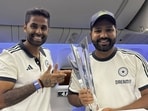 India's captain Rohit Sharma and Suryakumar Yadav pose with the ICC Men's T20 cricket World Cup 2024 trophy aboard a flight India's captain Rohit Sharma and Suryakumar Yadav pose with the ICC Men's T20 cricket World Cup 2024 trophy aboard a flight