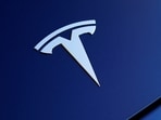 The front hood logo on a 2018 Tesla Model 3 electric vehicle is shown in this photo illustration taken in Cardiff, California, US.