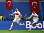 Turkey's defender #03 Merih Demiral (L) celebrates after scoring the opening goal during the UEFA Euro 2024 round of 16 football match against Austria