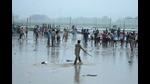Police officers control a crowd that gathered at the site of Tuesday's stampede as it rains in Hathras district, Uttar Pradesh, India, Wednesday, July 3, 2024. Severe overcrowding and a lack of exits contributed to a stampede at a religious festival in northern India, authorities said Wednesday, leaving more than 100 people dead as the faithful surged toward the preacher to touch him and chaos ensued. (AP Photo/Rajesh Kumar Singh) (AP)