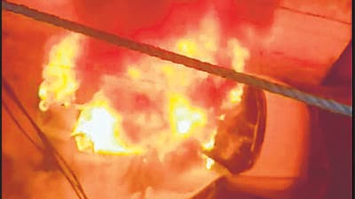 A video grab of the car on fire. (HT photo)