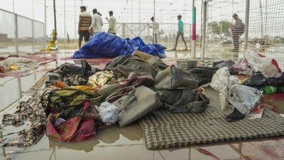 Bags and other belongings lying at the scene a day after a massive stampede that took place during a 'satsang' (religious congregation), in Sikandara Rao area in Hathras district on Wednesday. (PTI) Bags and other belongings lying at the scene a day after a massive stampede that took place during a 'satsang' (religious congregation), in Sikandara Rao area in Hathras district on Wednesday. (PTI)