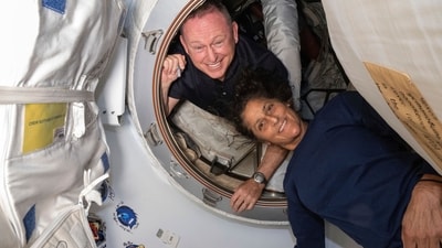 In this photo provided by NASA, Boeing Crew Flight Test astronauts Butch Wilmore, left, and Suni Williams pose for a portrait inside the vestibule between the forward port on the International Space Station's Harmony module and Boeing's Starliner spacecraft on June 13, 2024. (NASA via AP) (AP) In this photo provided by NASA, Boeing Crew Flight Test astronauts Butch Wilmore, left, and Suni Williams pose for a portrait inside the vestibule between the forward port on the International Space Station's Harmony module and Boeing's Starliner spacecraft on June 13, 2024. (NASA via AP) (AP)