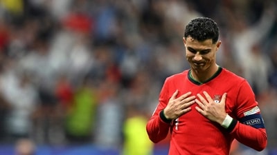 Portugal's forward #07 Cristiano Ronaldo reacts after winning the UEFA Euro 2024 round of 16 football match against Slovenia (AFP)