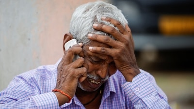 Chedilal, 65, father of Ruby who died in a stampede, speaks on the phone as he mourns outside a hospital in Hathras district of Uttar Pradesh on July 3, 2024. (REUTERS)