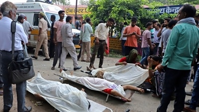 People stand around the bodies lying covered on stretchers outside the Sikandrarao hospital in Hathras district about 350 kilometers (217 miles) southwest of Lucknow, India, Tuesday (AP) People stand around the bodies lying covered on stretchers outside the Sikandrarao hospital in Hathras district about 350 kilometers (217 miles) southwest of Lucknow, India, Tuesday (AP)