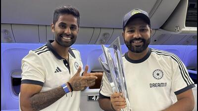 India's captain Rohit Sharma with Suryakumar Yadav pose with the ICC T20 World Cup trophy aboard a flight as they depart for India, in Bridgetown, Barbados. (PTI) India's captain Rohit Sharma with Suryakumar Yadav pose with the ICC T20 World Cup trophy aboard a flight as they depart for India, in Bridgetown, Barbados. (PTI)