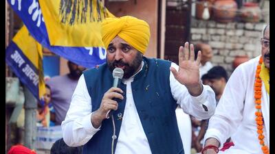 Punjab chief minister Bhagwant Singh Mann during a roadshow in Jalandhar on Tuesday. (ANI)