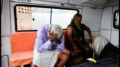 Relatives mourn outside a hospital in Hathras. (REUTERS) Relatives mourn outside a hospital in Hathras. (REUTERS)