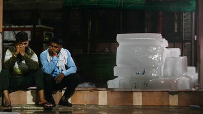 Relatives outside the morgue of a hospital in Hathras. (AFP) Relatives outside the morgue of a hospital in Hathras. (AFP)