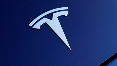 The front hood logo on a 2018 Tesla Model 3 electric vehicle is shown in this photo illustration taken in Cardiff, California, US. (Reuters)