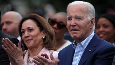 US President Joe Biden claps hands next to US Vice-President Kamala Harris. (Reuters)