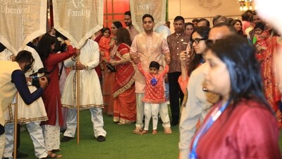 Akash Ambani also posed for pictures with his son, who looked ready to run around and soak in the festivities. Akash Ambani also posed for pictures with his son, who looked ready to run around and soak in the festivities.