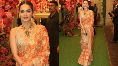 Manushi Chhillar dazzled in an orange and gold saree, posing for a few pictures before she made her way inside. Manushi Chhillar dazzled in an orange and gold saree, posing for a few pictures before she made her way inside.