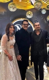 Varalaxmi Sarathkumar with her father Sarathkumar and Nicholai Sachdev. Varalaxmi Sarathkumar with her father Sarathkumar and Nicholai Sachdev.