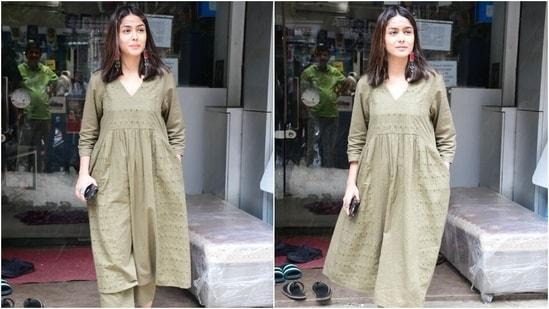 Mrunal Thakur embraced breezy clothing for summer in an olive green-coloured anarkali kurta and palazzo pants. She styled the ensemble with statement red jhumkis, serving a steal-worthy ensemble to beat the heat.&nbsp;(HT Photo/Varinder Chawla)