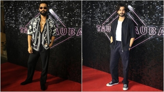 Vicky Kaushal and Sunny Kaushal attended the promotional event for the former's upcoming film Bad Newz. Vicky made a dapper appearance at the affair in a printed shirt, coordinated cropped jacket and black pants. He styled the ensemble with a sleek chain, sunglasses, and a backswept hairdo. Meanwhile, Sunny complemented his brother in a white tee, black shacket, and blue pants styled with sneakers.&nbsp;(HT Photo/Varinder Chawla)