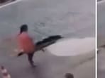 A viral video shows a woman falling into a sinkhole.