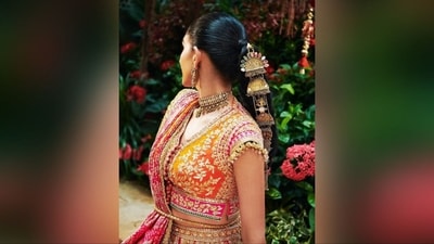 She pulled back her long, black, luscious tresses and styled them into a high braided ponytail adorned with golden ornaments, exuding sheer royal vibes. (Instagram) She pulled back her long, black, luscious tresses and styled them into a high braided ponytail adorned with golden ornaments, exuding sheer royal vibes. (Instagram)