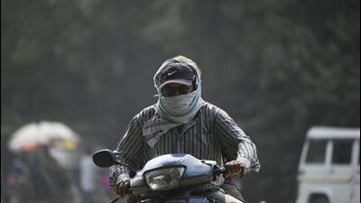 A person commutes in Delhi covering his face amid air pollution in November 2023. (File Photo) A person commutes in Delhi covering his face amid air pollution in November 2023. (File Photo)