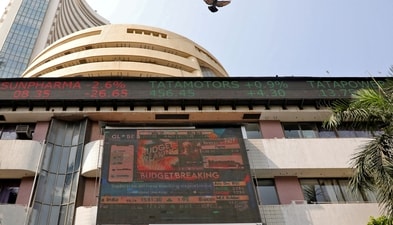 Stock market today: A bird flies past a screen displaying the Sensex results on the facade of the Bombay Stock Exchange (BSE) building in Mumbai. (Reuters)